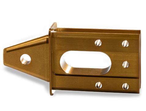 One shiny gold machined part.