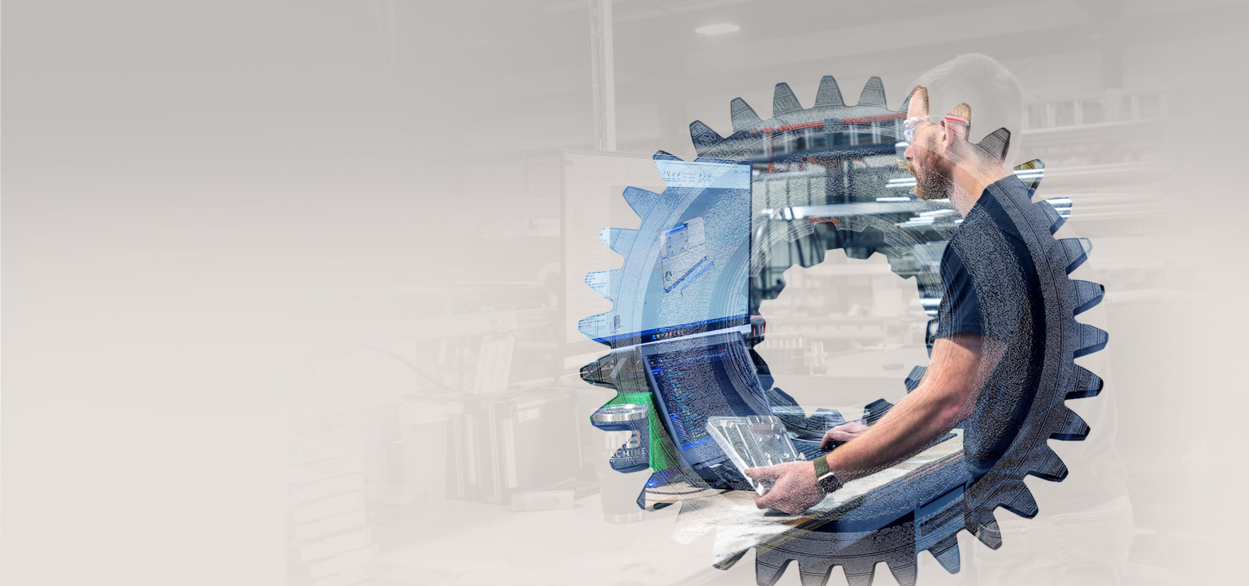 A man using a desktop computer to look at CAD drawings.